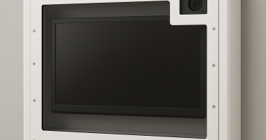 A behavioral health TV enclosure with integrated camera window, wall-mounted with anti-ligature design and tamperproof fasteners.